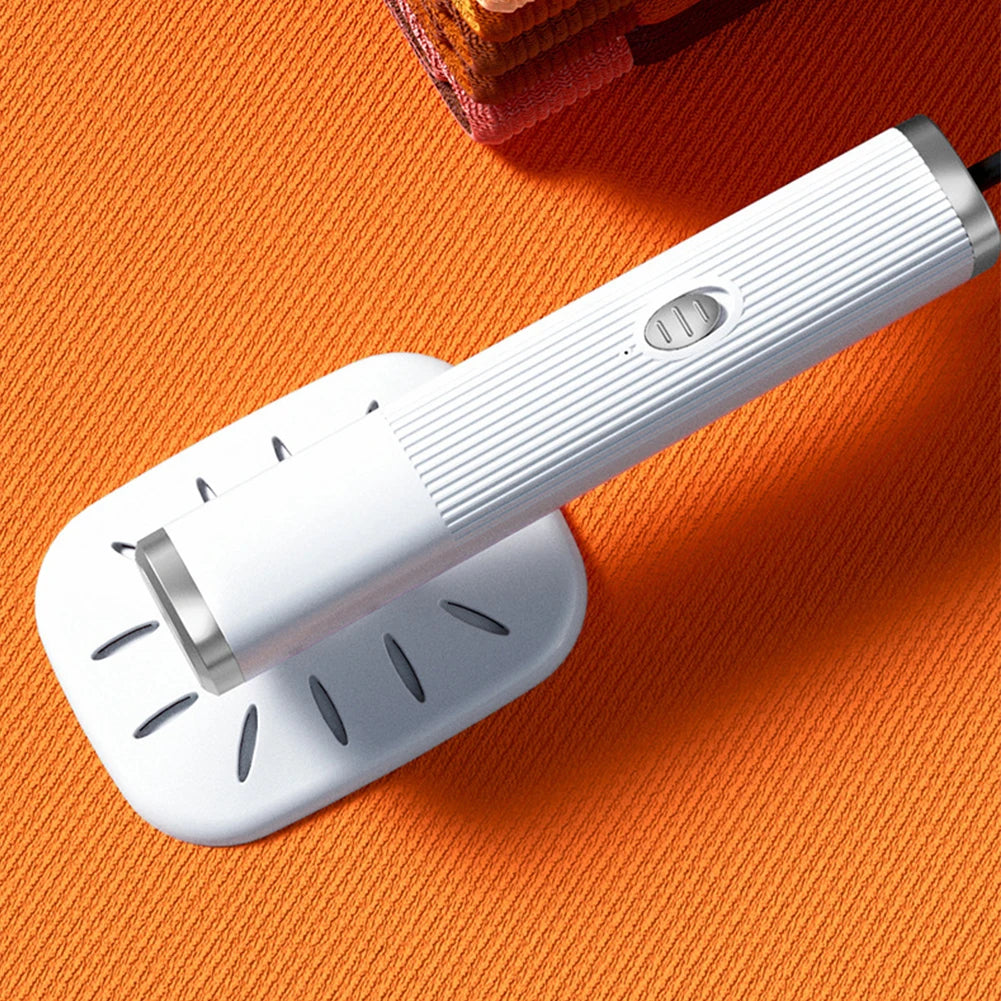 Velmora Living handheld iron steamer with 360° rotating head, used for dry and wet steaming of clothes and fabrics.